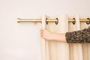 how to fix curtain pole